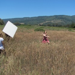 emily dances to the song in a field